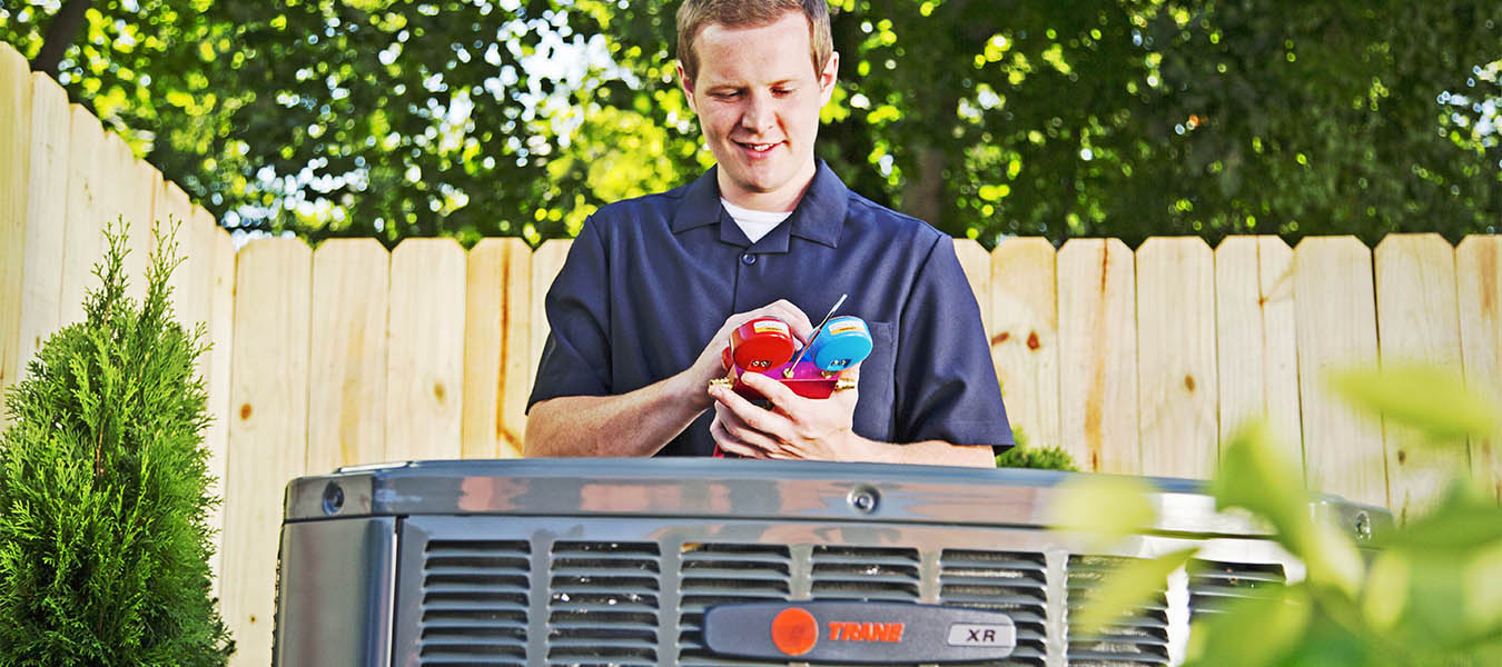 Tran technician checking gauges