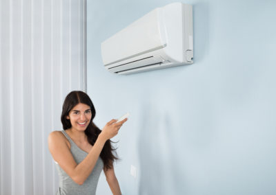 woman with Ductless Air Conditioner