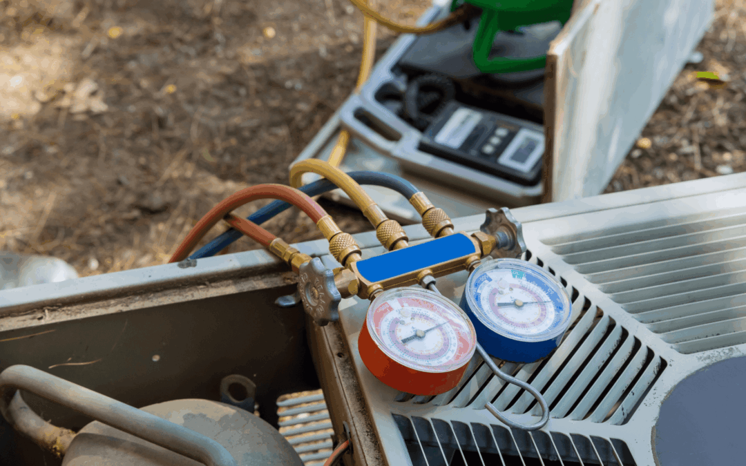 Close-up of gauges and hoses connected to an AC unit, symbolizing the diagnostic process during emergency HVAC services.
